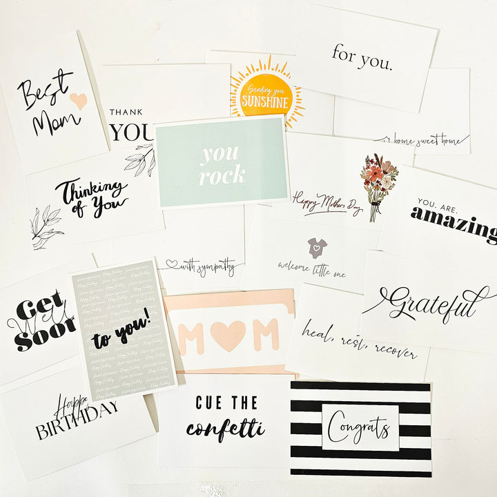 A varied collection of personalized note cards with messages such as 'Best Mom', 'Thank You', 'You Rock', and 'Happy Birthday', among others, perfect for customizing your gift box or basket with a thoughtful touch for any special occasion.
