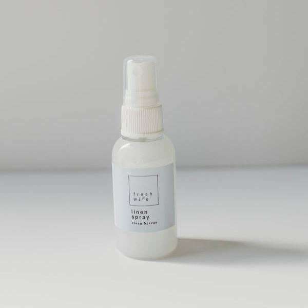 White spray bottle labeled &