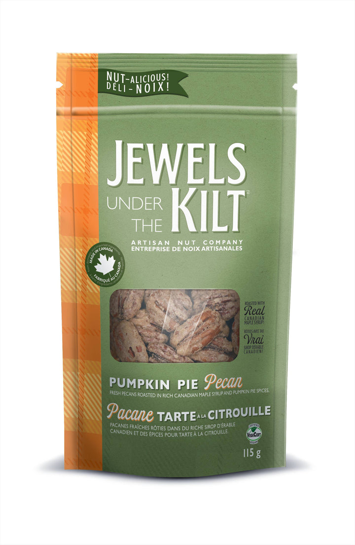 A 115 g bag of Jewels Under the Kilt Pumpkin Pie Pecan, featuring a green and orange package design with a clear window showing the pecans inside.