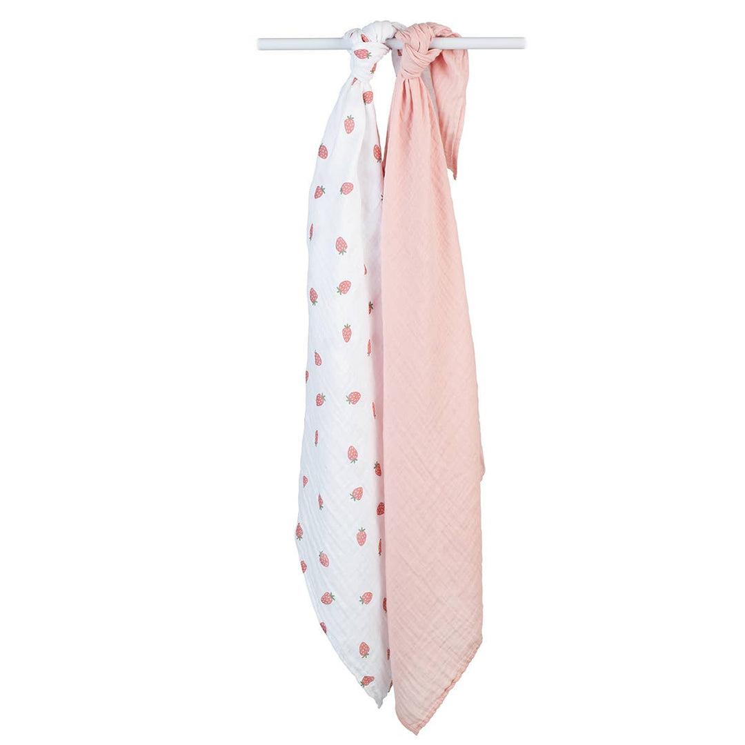 Lulujo Baby 2-pack cotton swaddle blankets with strawberry and ballet slipper patterns, soft and breathable for newborns.