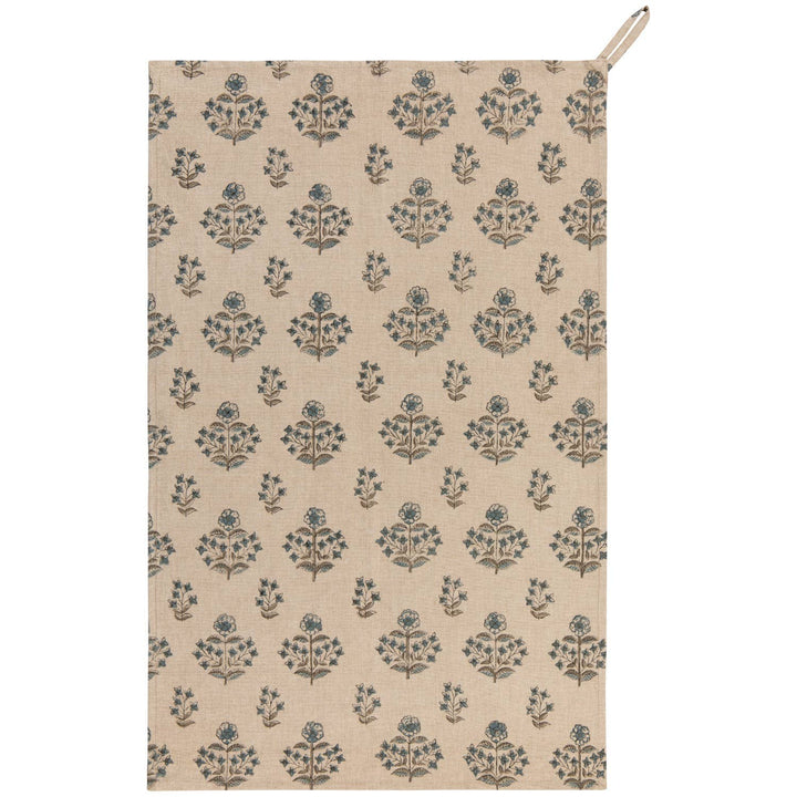 Beige towel with blue floral pattern on a white background