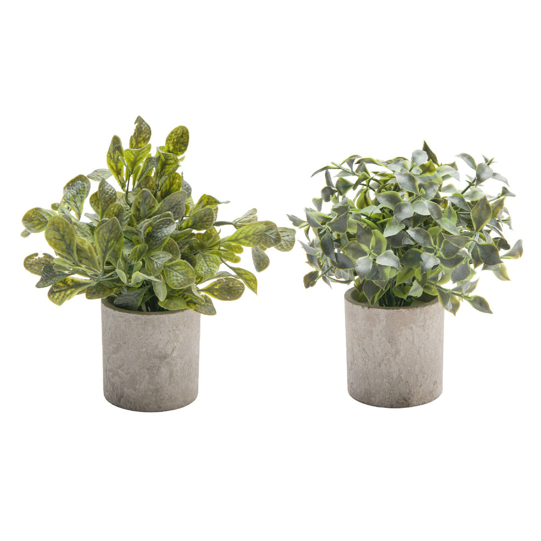 Two artificial plants in gray pots on a white background