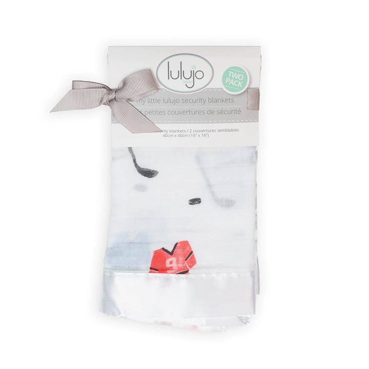Lulujo security blanket packaging with a cartoon cow design on a white background