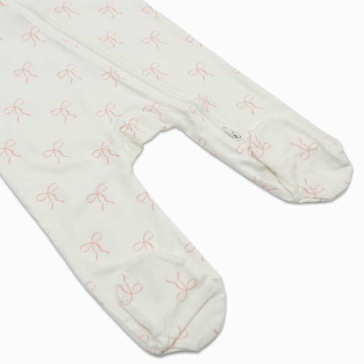 White tights with pink bow pattern on a white background