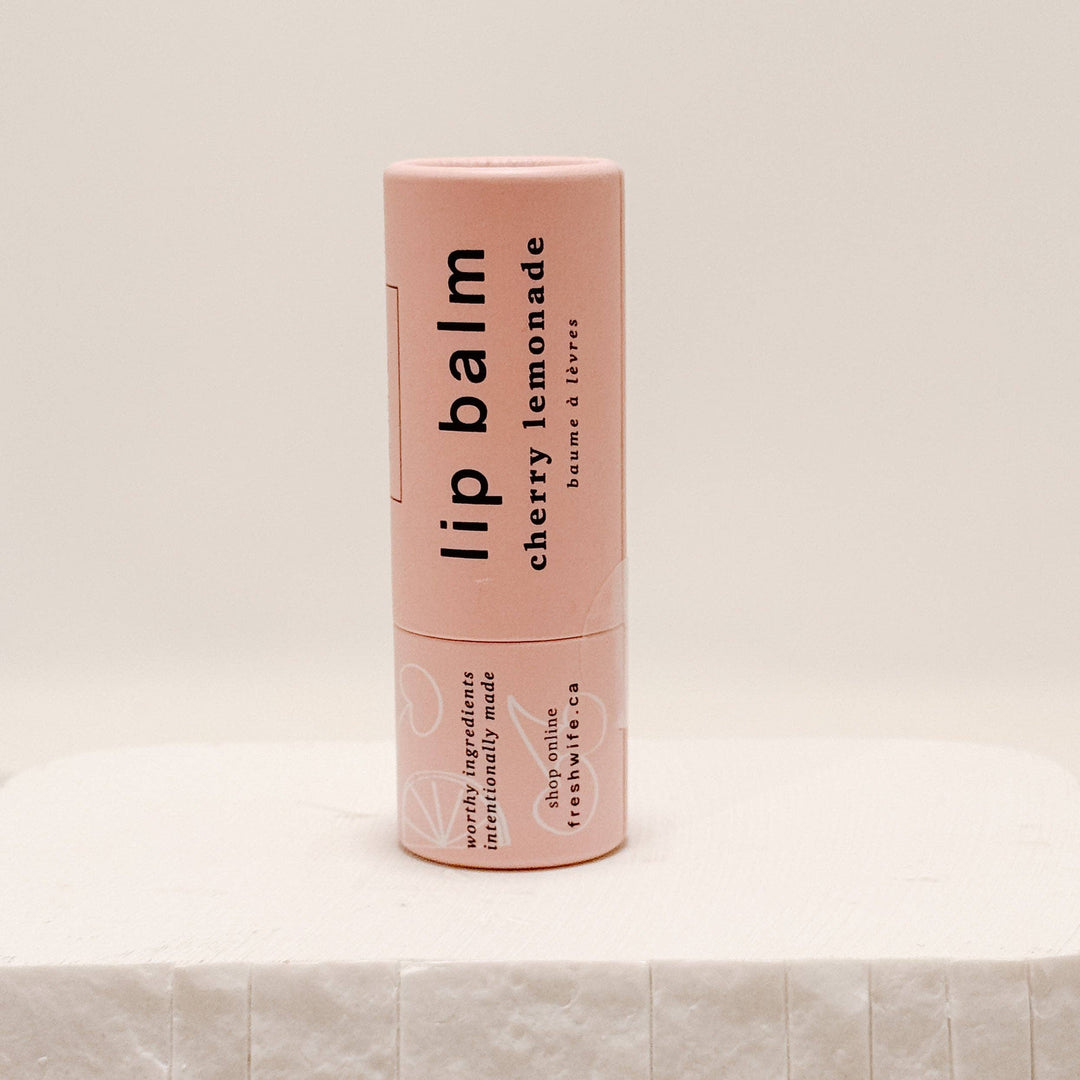 Cherry Lemonade lip balm by The Fresh Wife Soap Company, showing a tube with cherry and lemon flavor branding.