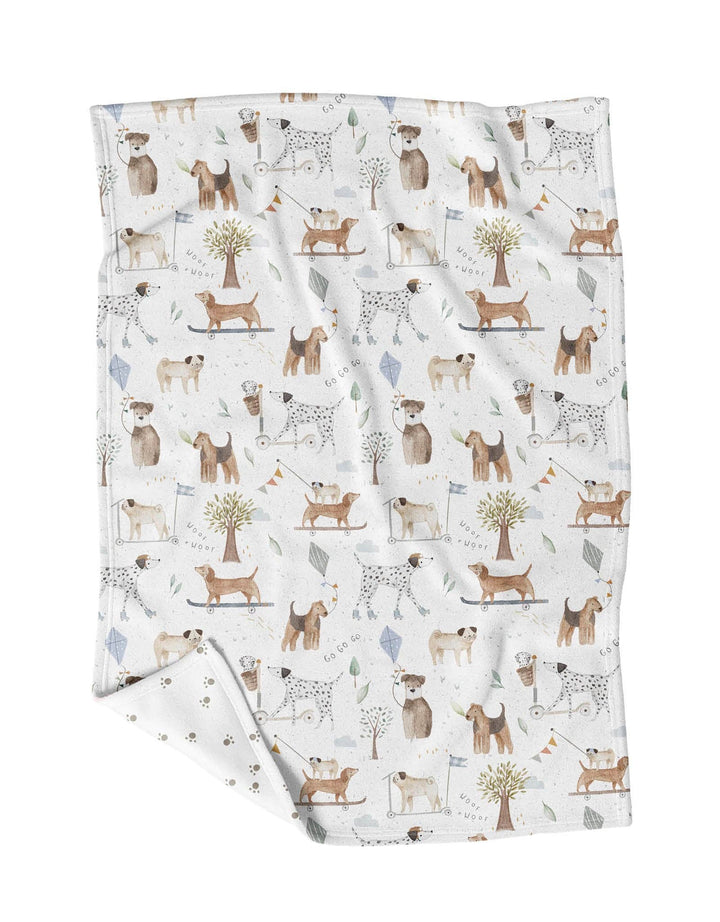 Folded blanket with dog pattern on a white background
