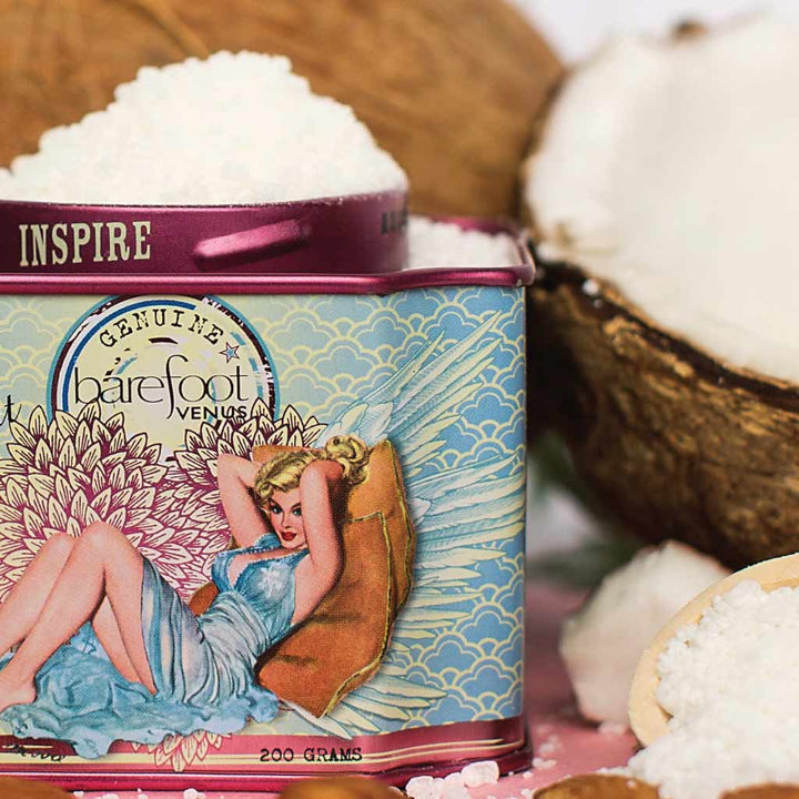 Barefoot Venus product packaging with coconut and sugar in the background