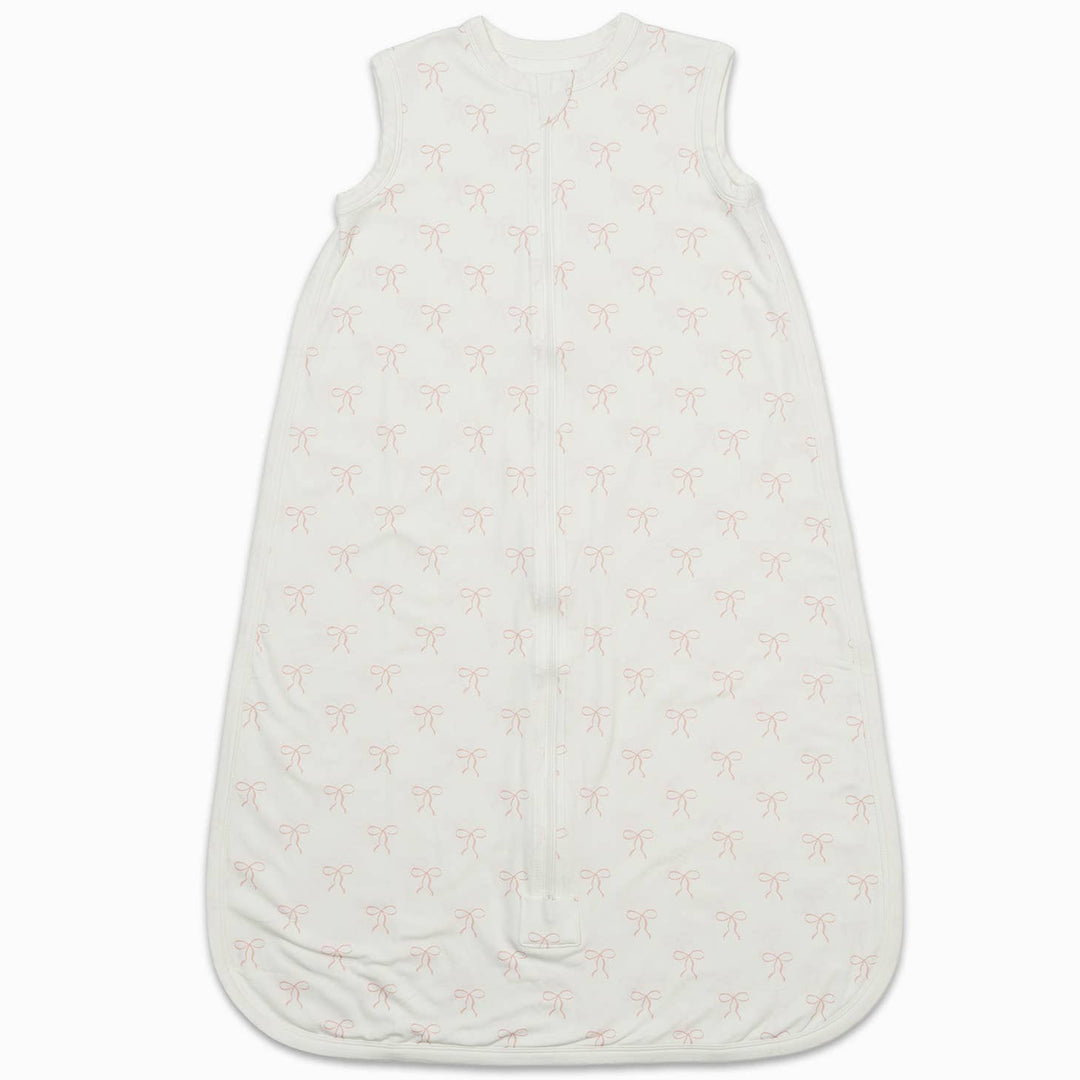 An off-white sleeveless baby sleep sack with a light pink palm tree pattern, shown flat against a white background.