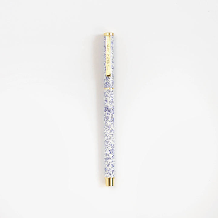 Decorative pen with crystal design on a white background