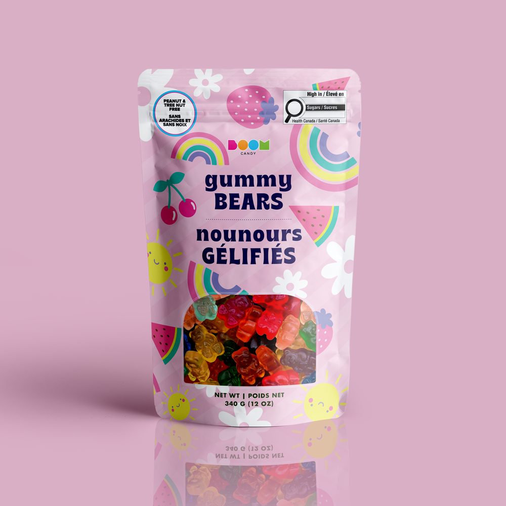 A stand-up pouch of DooM Gummy Bears (nourris gélifiés) candy, featuring a pastel pink background decorated with colorful watercolor rainbows, cherries, strawberries, and smiling sun faces. A clear window at the bottom reveals the colorful gummy bears inside.