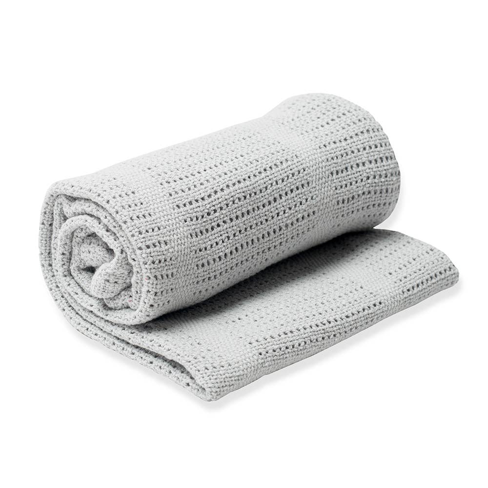 Rolled-up gray textured blanket on a white background