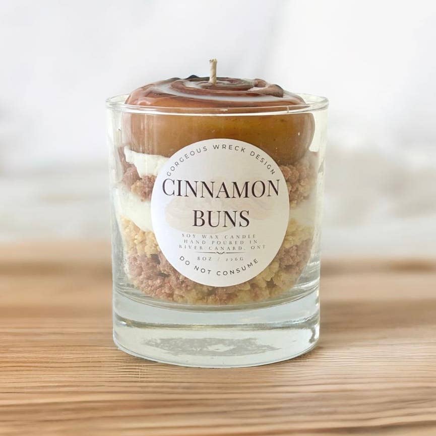 Candle in a glass jar labeled &
