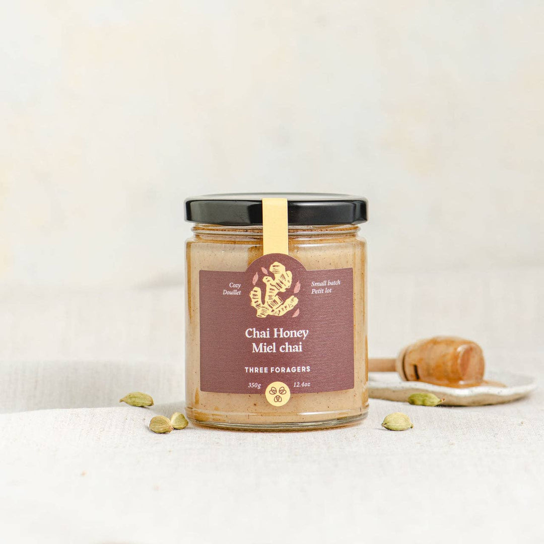 Jar of Three Foragers Chai Infused Honey with a golden hue, labeled as 350 g, highlighting its gourmet honey with chai infusion.