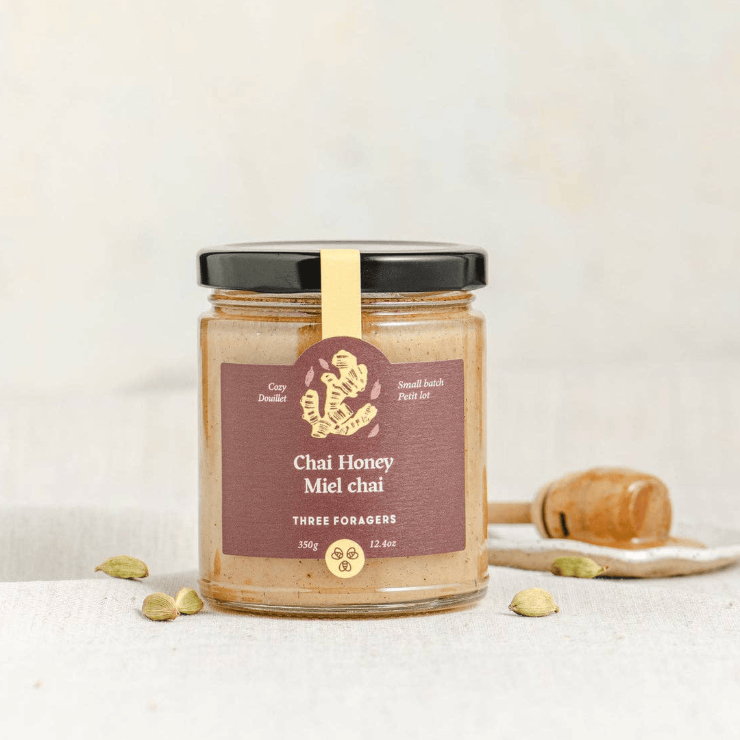 Jar of Three Foragers Chai Infused Honey in a 350g glass jar, showcasing the golden honey with a chai spice infusion.