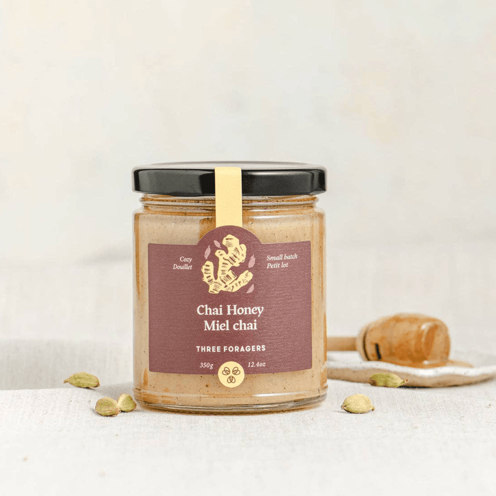 Jar of Three Foragers Chai Infused Honey in a 350g glass jar, showcasing the golden honey with a chai spice infusion.