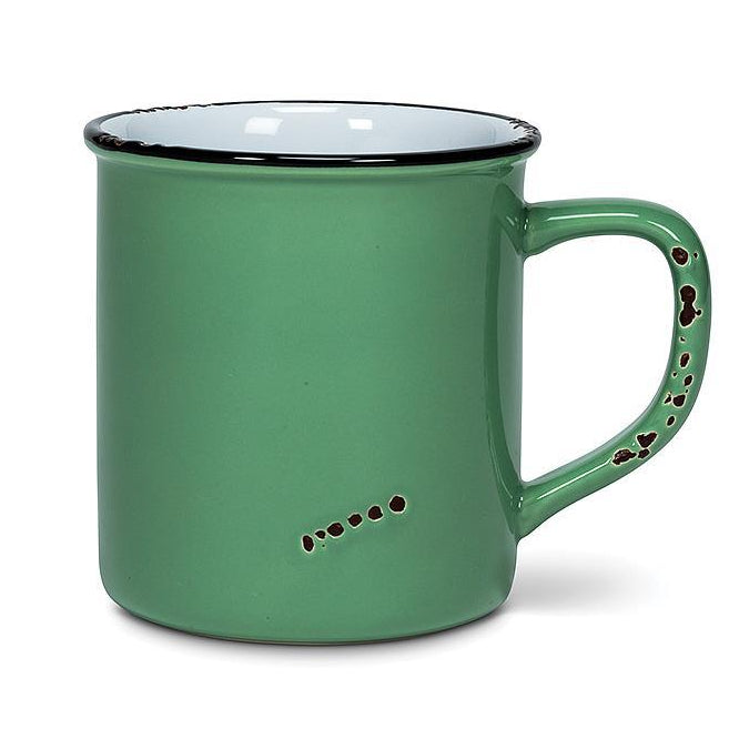 Green mug with decorative handle on a white background