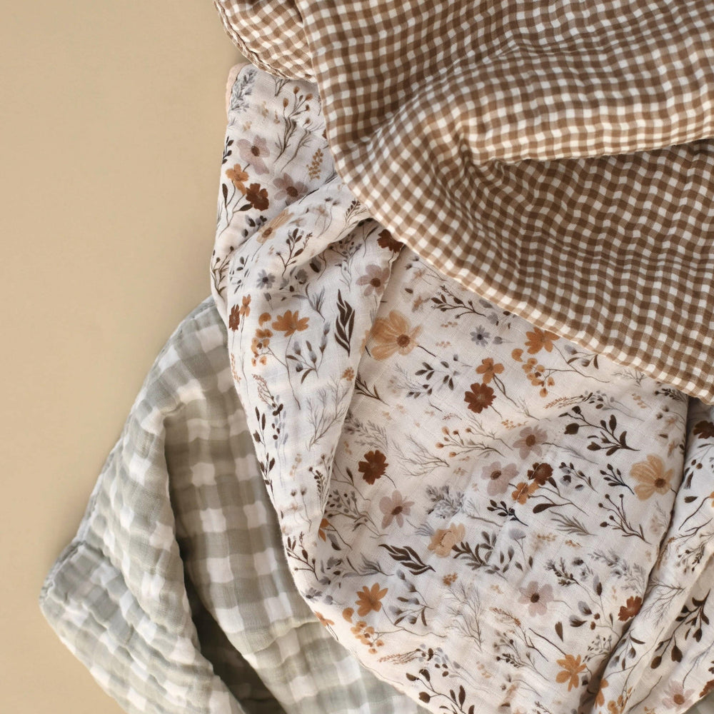 Three pieces of fabric with different patterns on a beige background