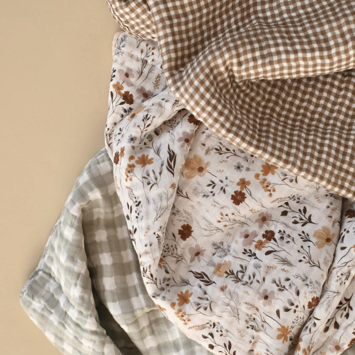 Three pieces of fabric with different patterns on a beige background