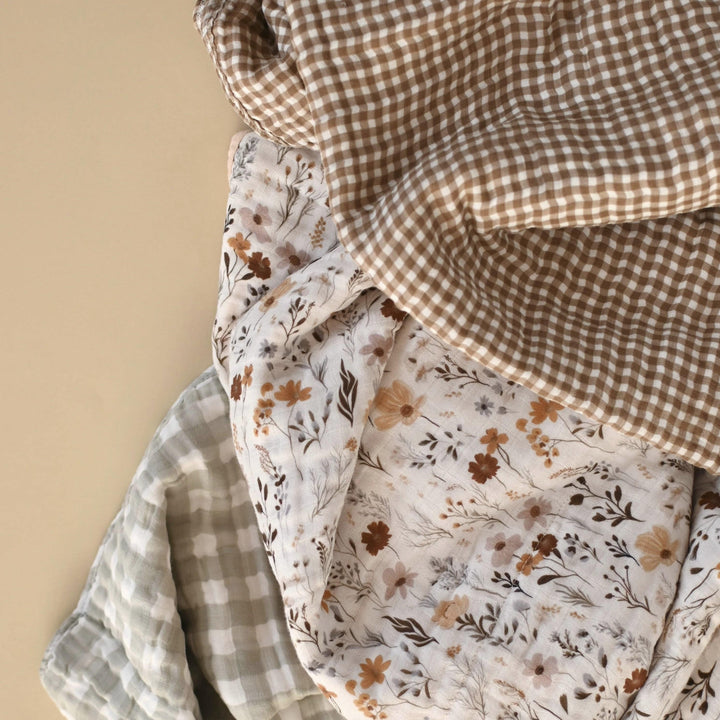 Three pieces of fabric with different patterns on a beige background