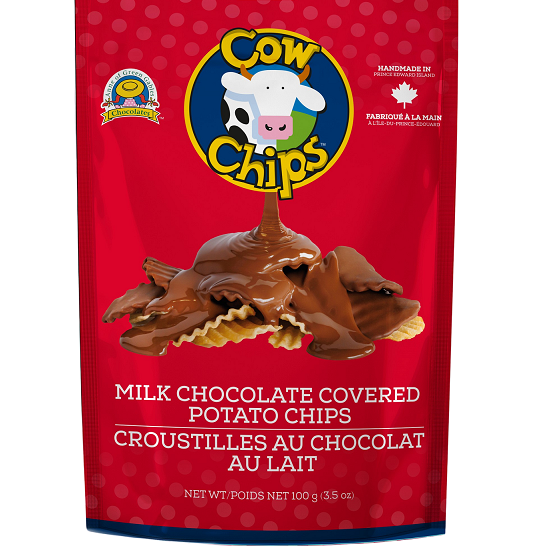 A red stand-up pouch of Cow Chips Milk Chocolate Covered Potato Chips, featuring a cartoon cow logo and an illustration of chocolate-covered chips on a white background.