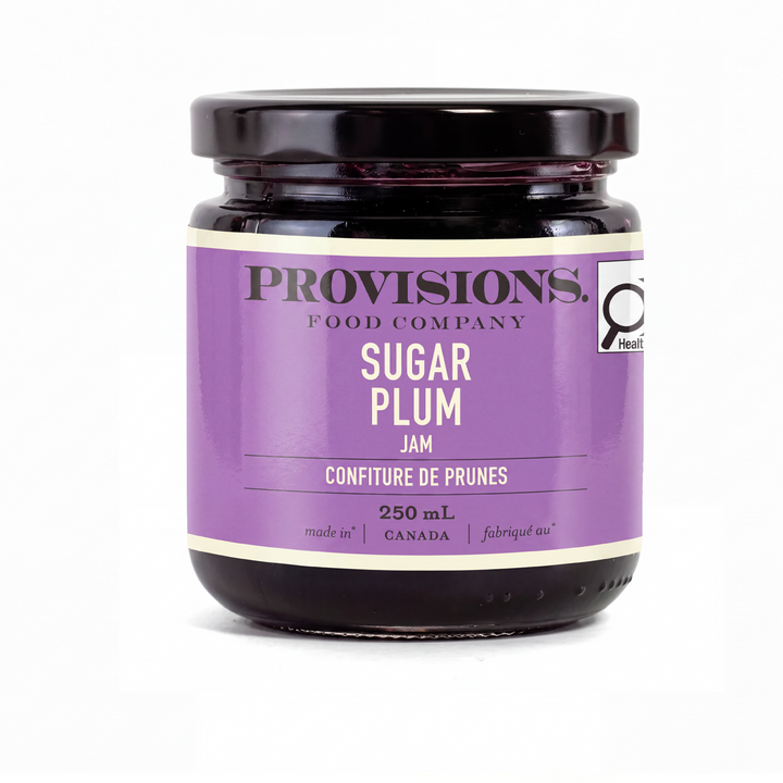 A jar of Provisions Food Company Sugar Plum Jam, 250 mL, featuring a purple label and black lid on a white background.