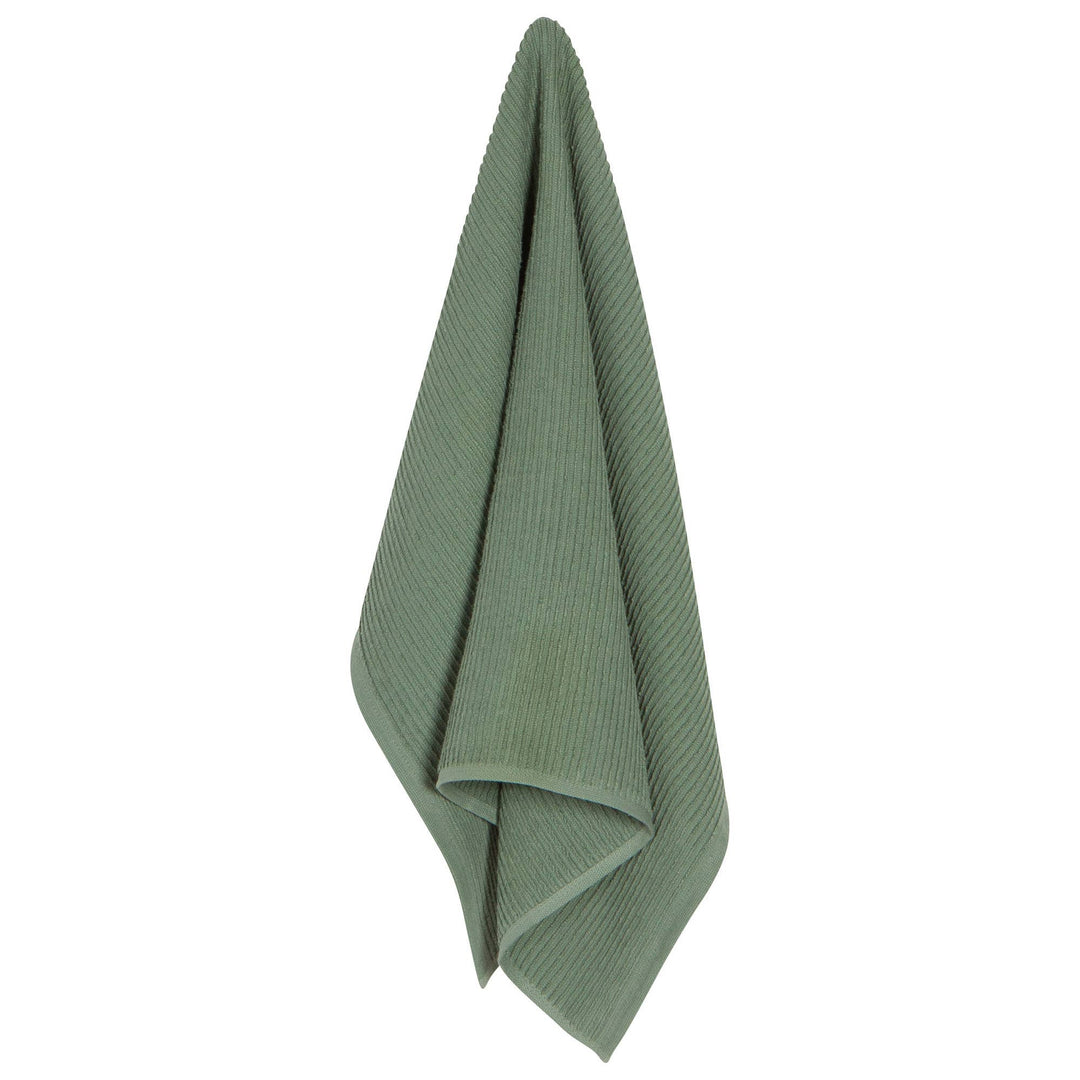 Green towel folded on a white background