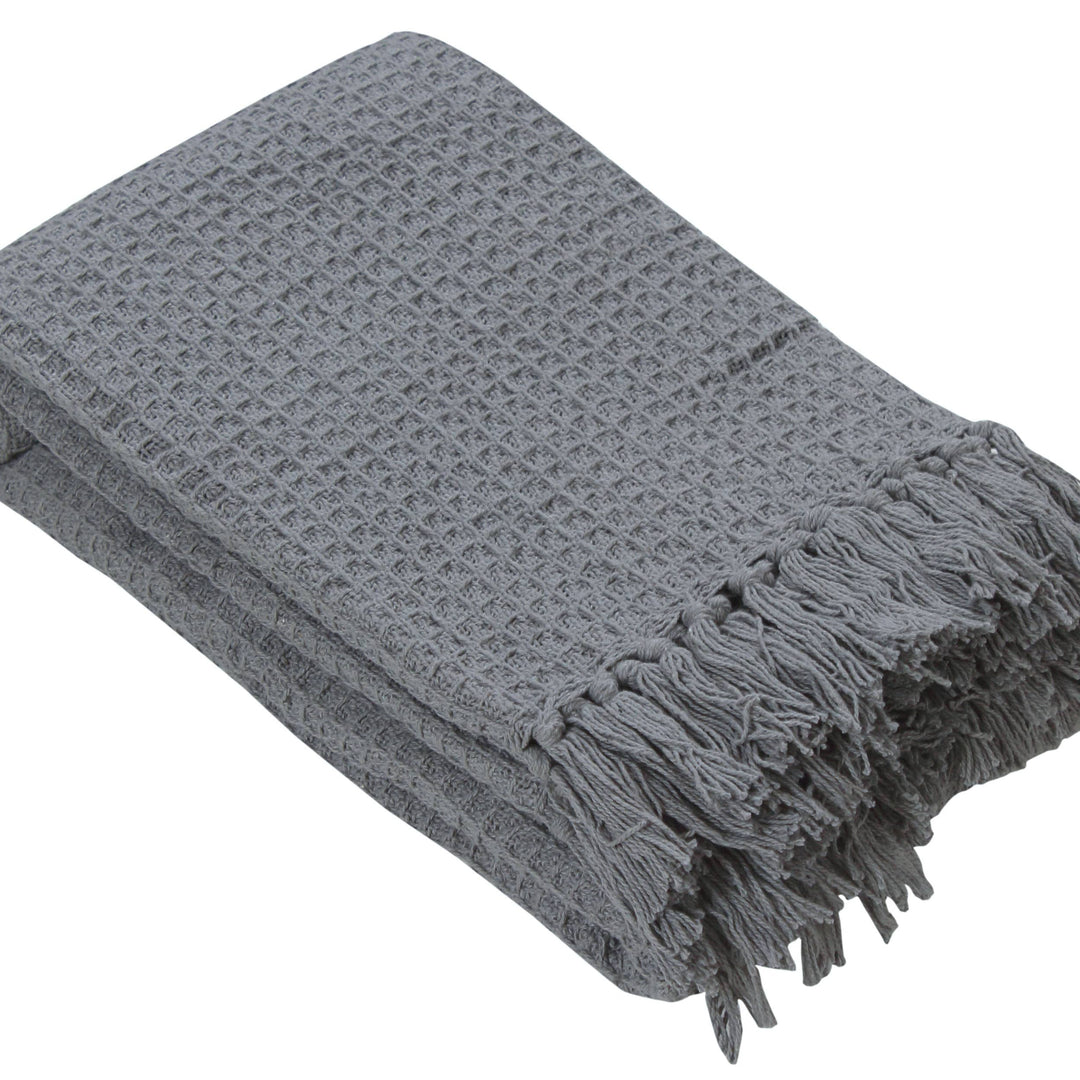 Gray textured throw blanket with fringes on a white background