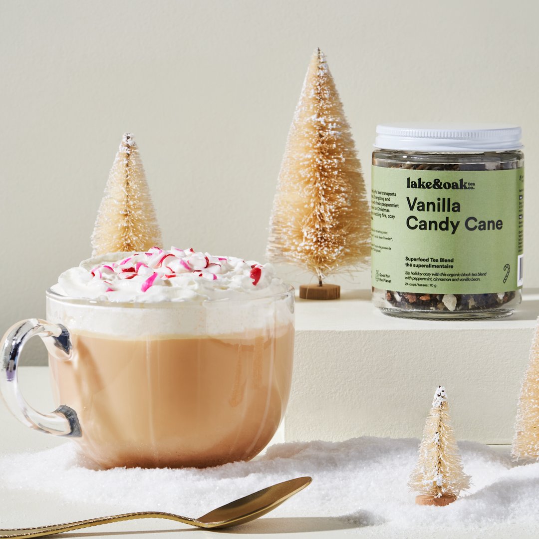 Lake &amp; Oak Tea Co. Vanilla Candy Cane tea in a glass loose-leaf jar, showcasing the tea leaves and festive packaging.