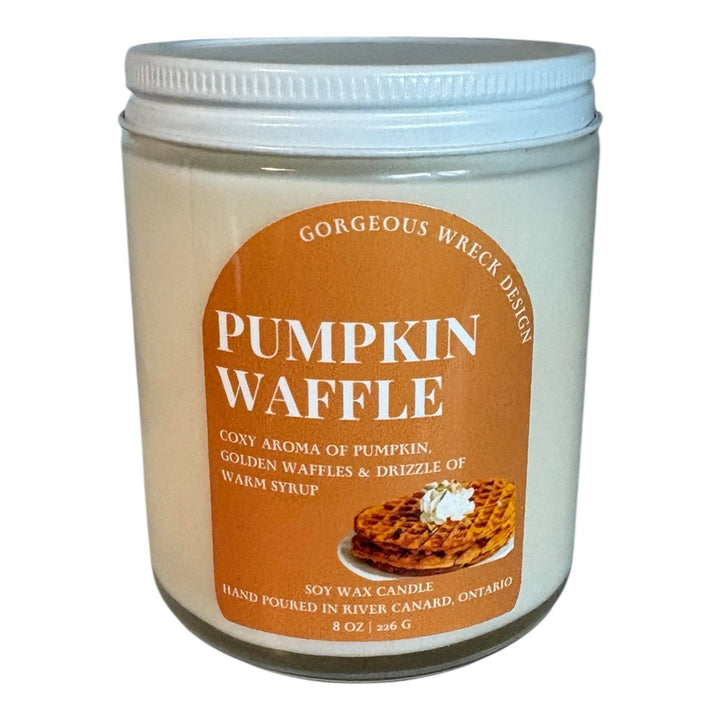 A 8 oz soy wax candle in a clear glass jar with a white lid, featuring a brown label that reads &