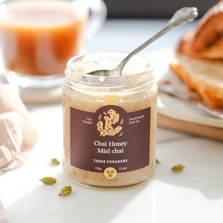 Jar of Three Foragers Chai Infused Honey, 350g, showcasing the honey with chai spices visible in the glass jar.