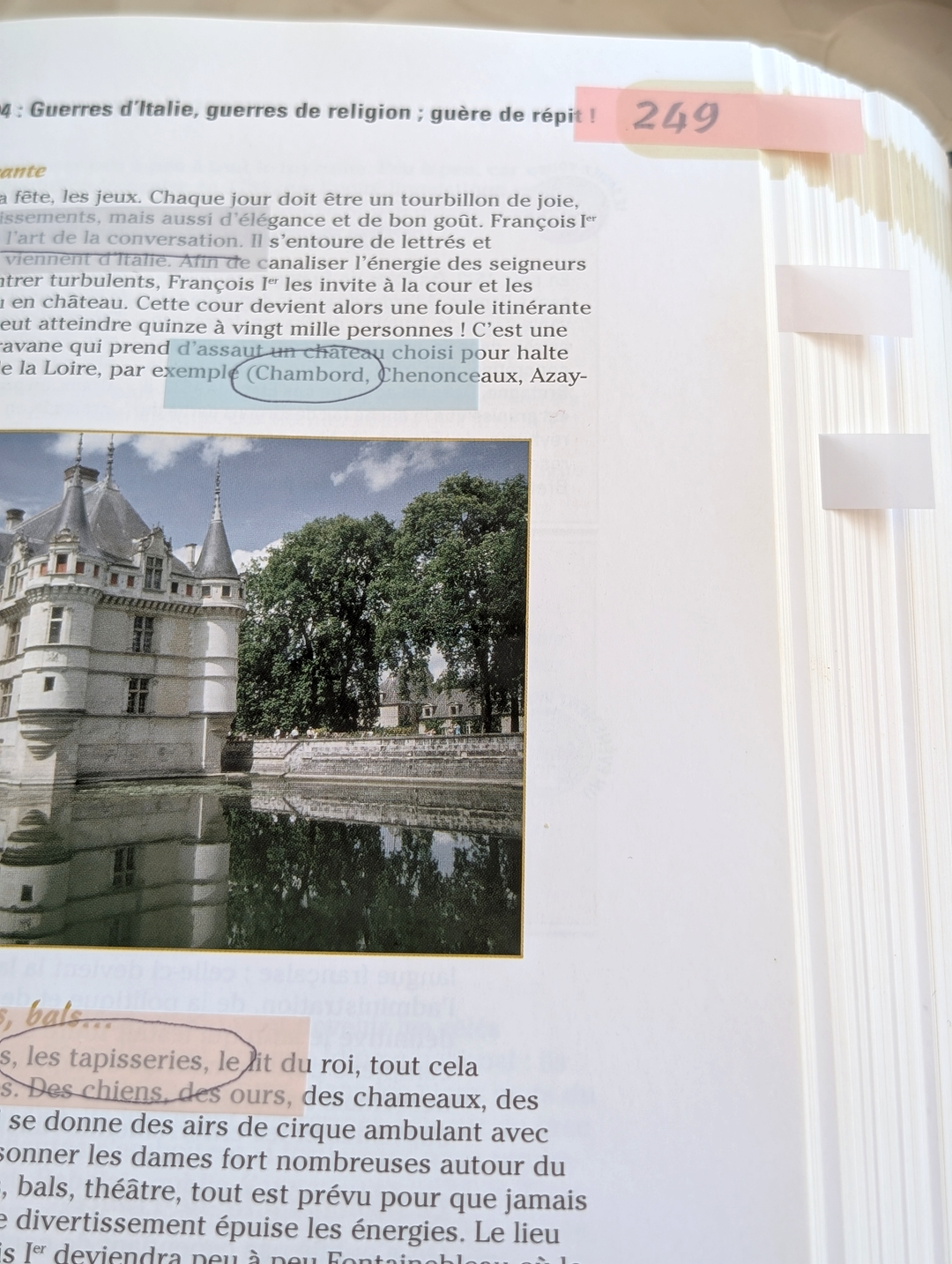Book page with an image of a castle and text
