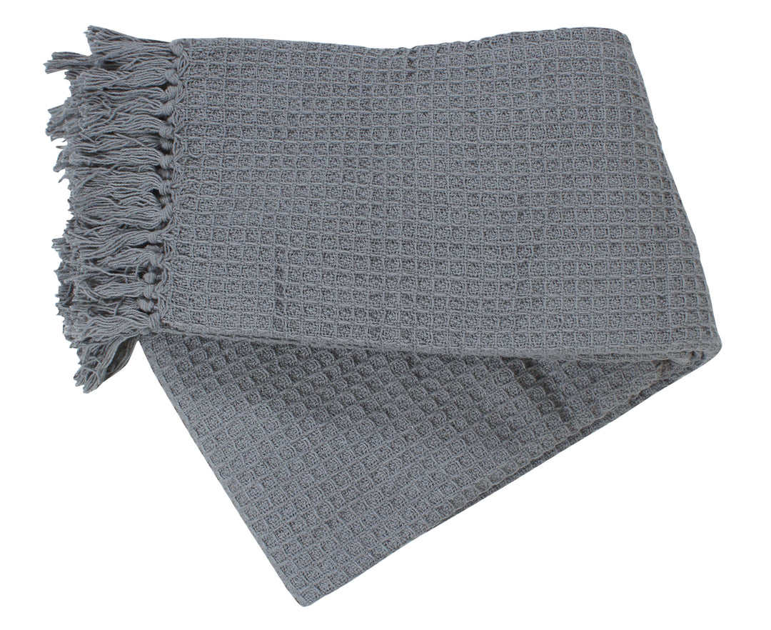 Gray textured throw blanket with tassels on a white background