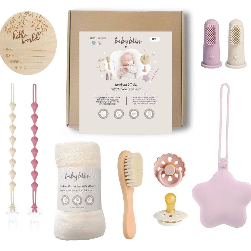 Baby bliss newborn gift set with various items including a brush, pacifier, and teether on a white background.