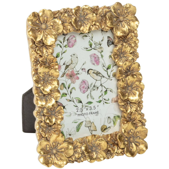 Decorative gold frame with floral design on a white background