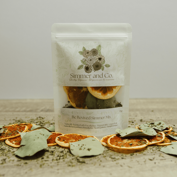 Simmer &amp; Co Be Revived simmer pot mix in a bowl, featuring dried herbs and spices for natural home fragrance.