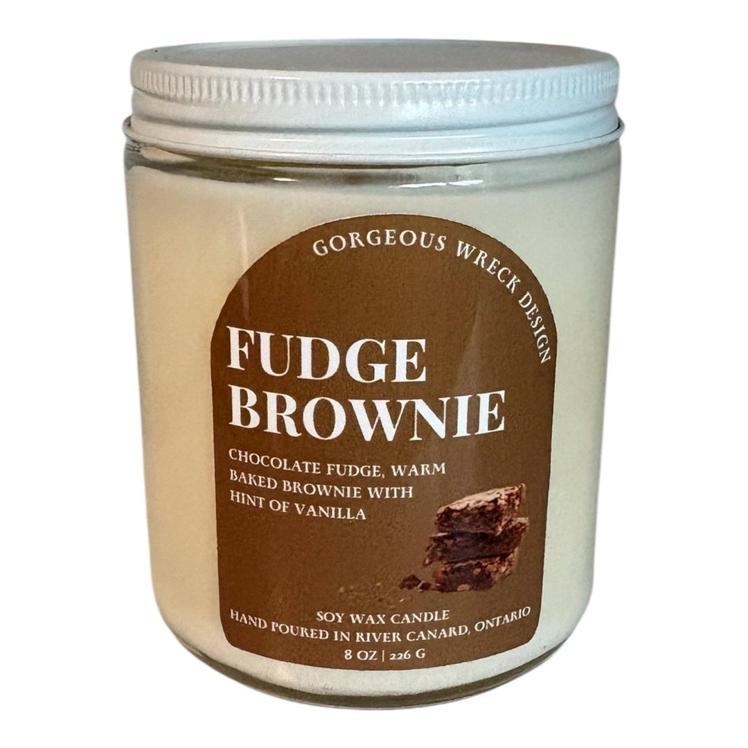 An 8 oz soy wax candle in a clear glass jar with a white screw-top lid, featuring a brown label that reads &