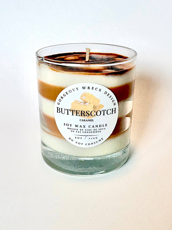Butterscotch candle with a label on a white background