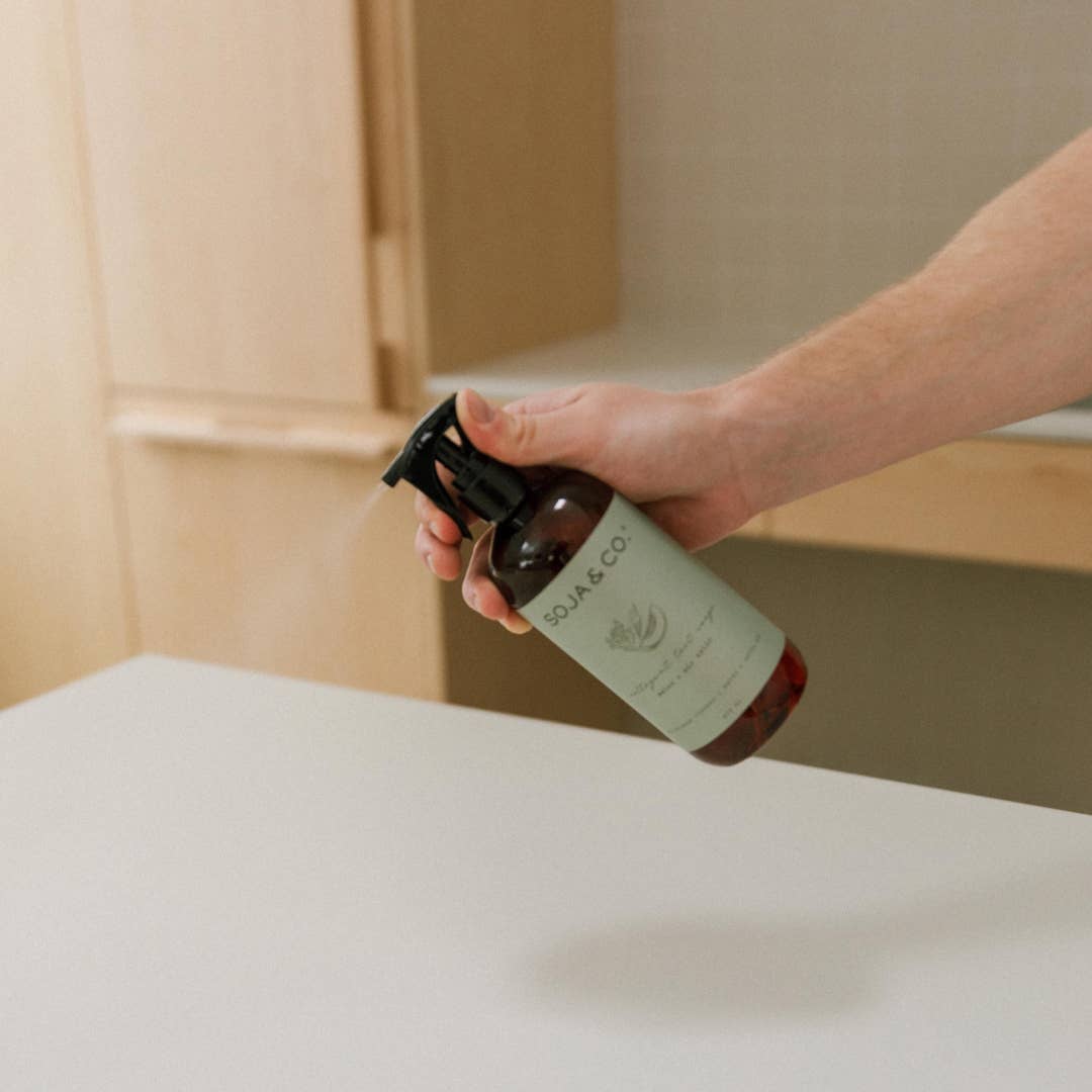 SOJA&amp;CO.® All Purpose Cleaner with Melon and Salty Air scent, showing a spray bottle with fresh, vibrant green label and cleaner inside.
