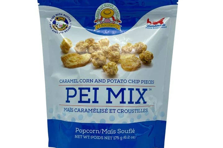 A stand-up pouch of Pei Mix caramel corn and potato chip pieces, featuring a blue and white design with a photo of the golden snack pieces on the front.
