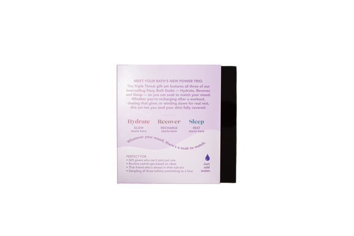 The back of a pinkish-purple and white box for a sleep aid product, with black side panels, photographed on a plain white background.