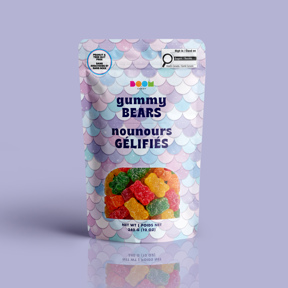 A stand-up pouch of 'gummy BEARS' gummy candy by the brand 'nouns', featuring a pastel mermaid-scale pattern in lavender, pink, and blue, with a clear window showing the colorful gummy bears inside.