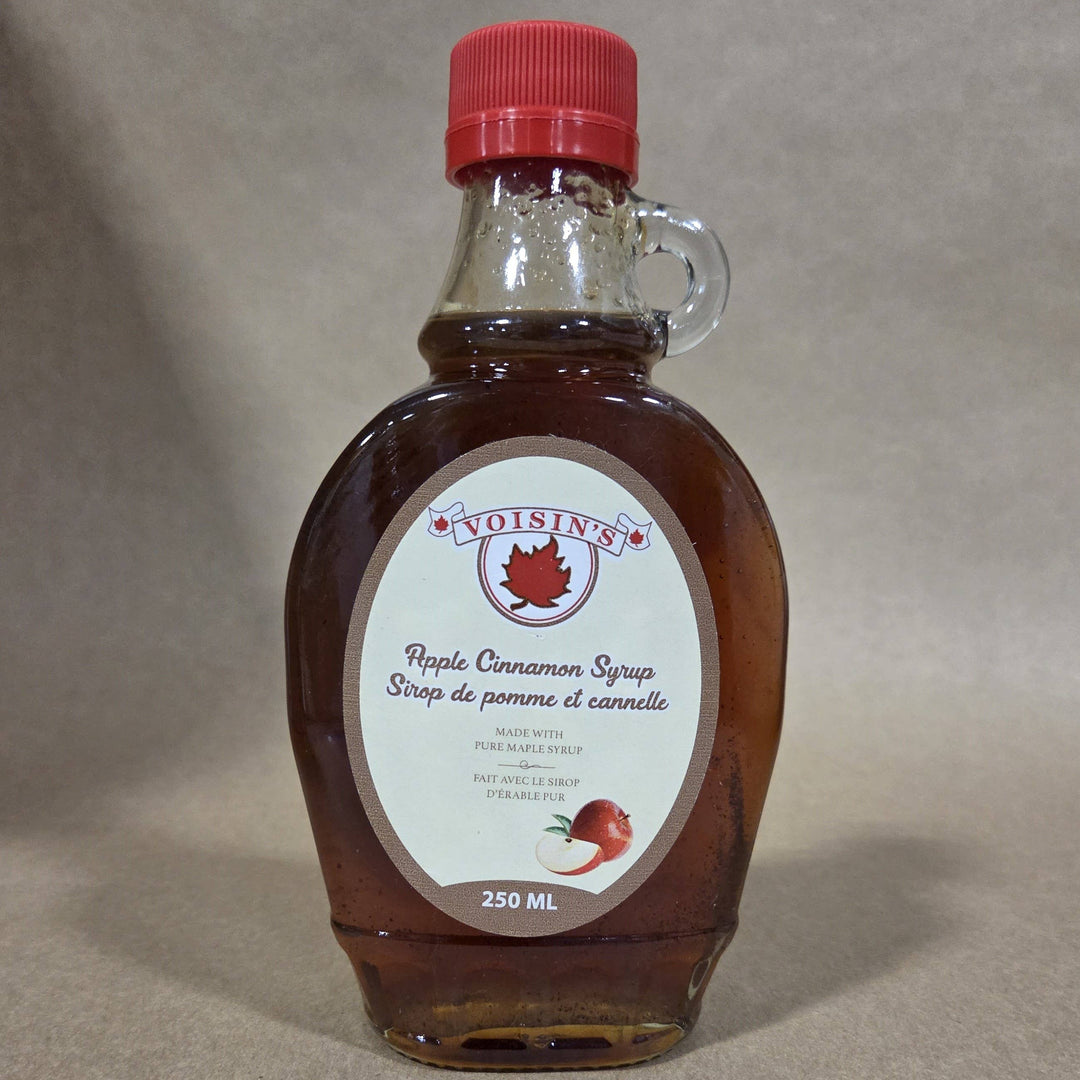 Bottle of Voisin's Apple Cinnamon Syrup on a neutral background