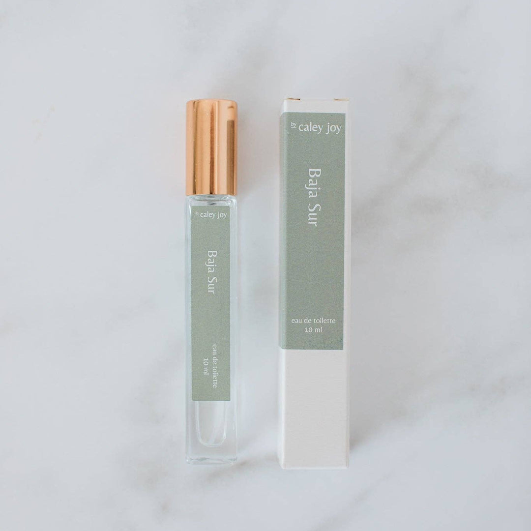 Perfume bottle and packaging on a light gray background