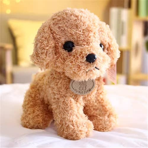 Plush toy dog with a tag on a white surface