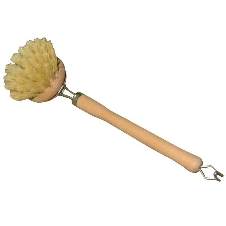 Dishwashing brush with wooden handle and natural bristles on a white background