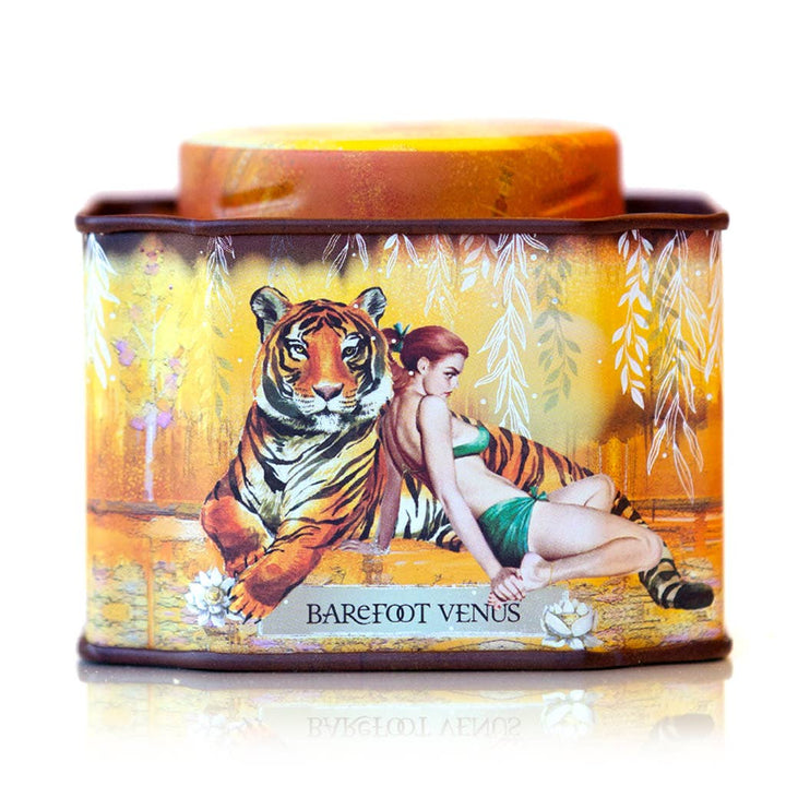 Tin container with a tiger and woman design, featuring the brand &