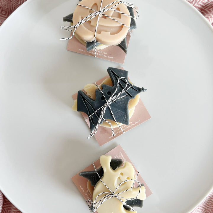 Three small Halloween-themed soaps shaped like a jack-o&