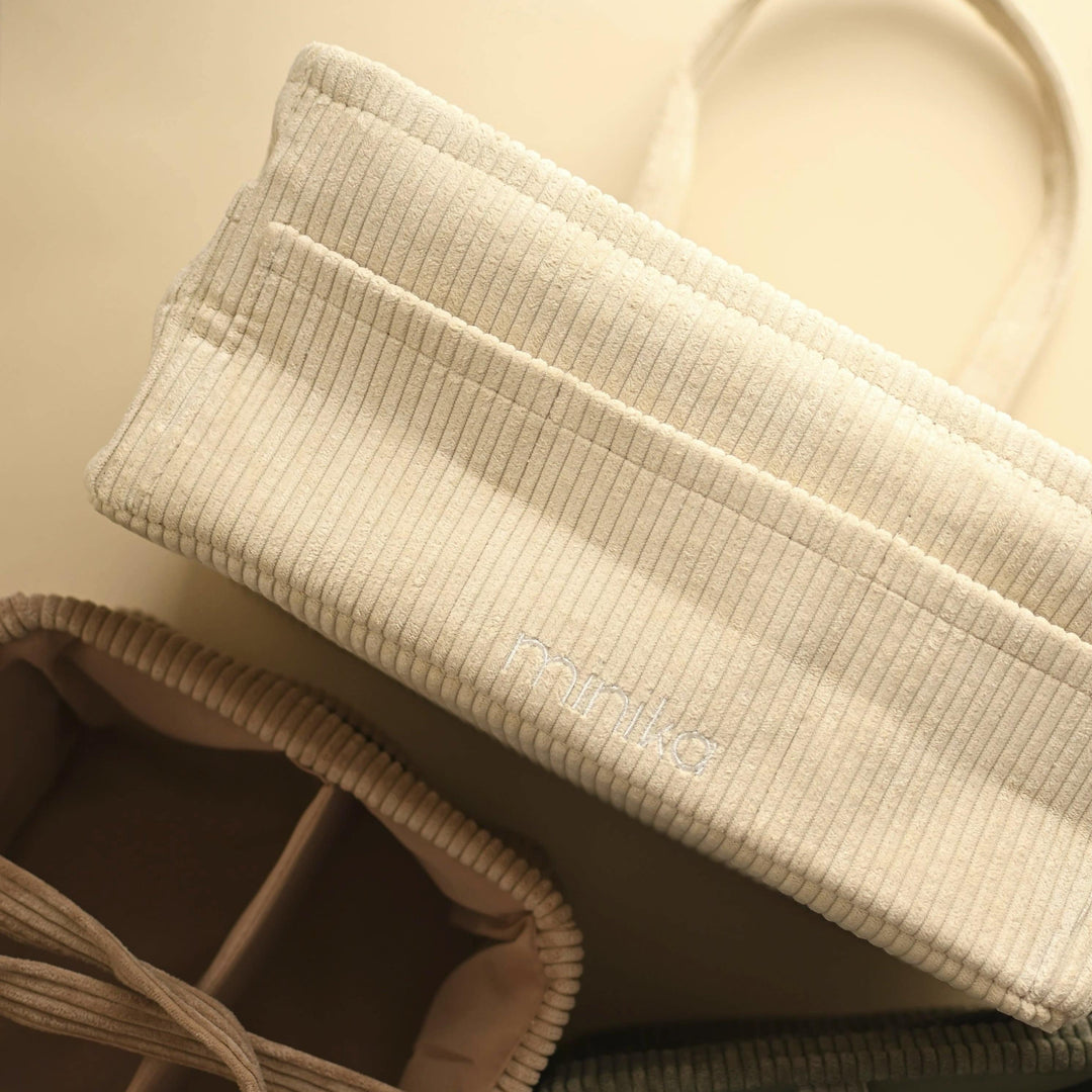 Close-up of beige textured bags on a beige background