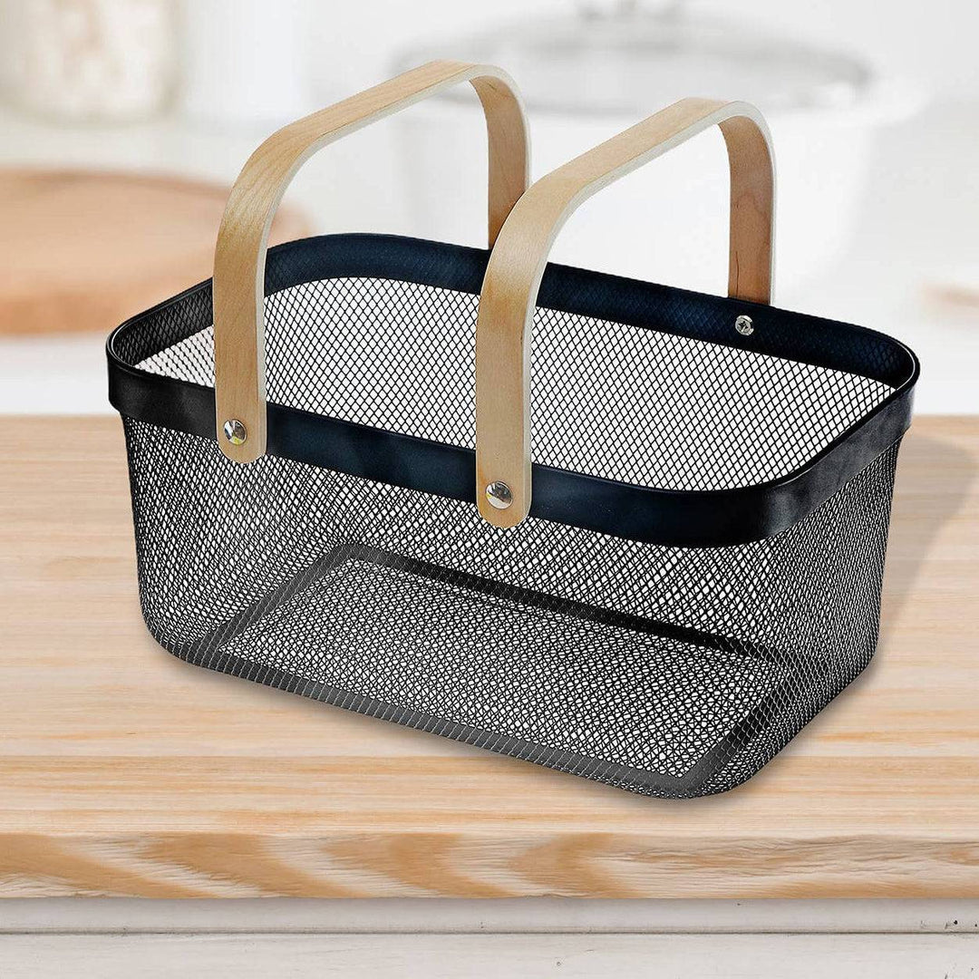 Black mesh basket with wooden handles on a kitchen counter