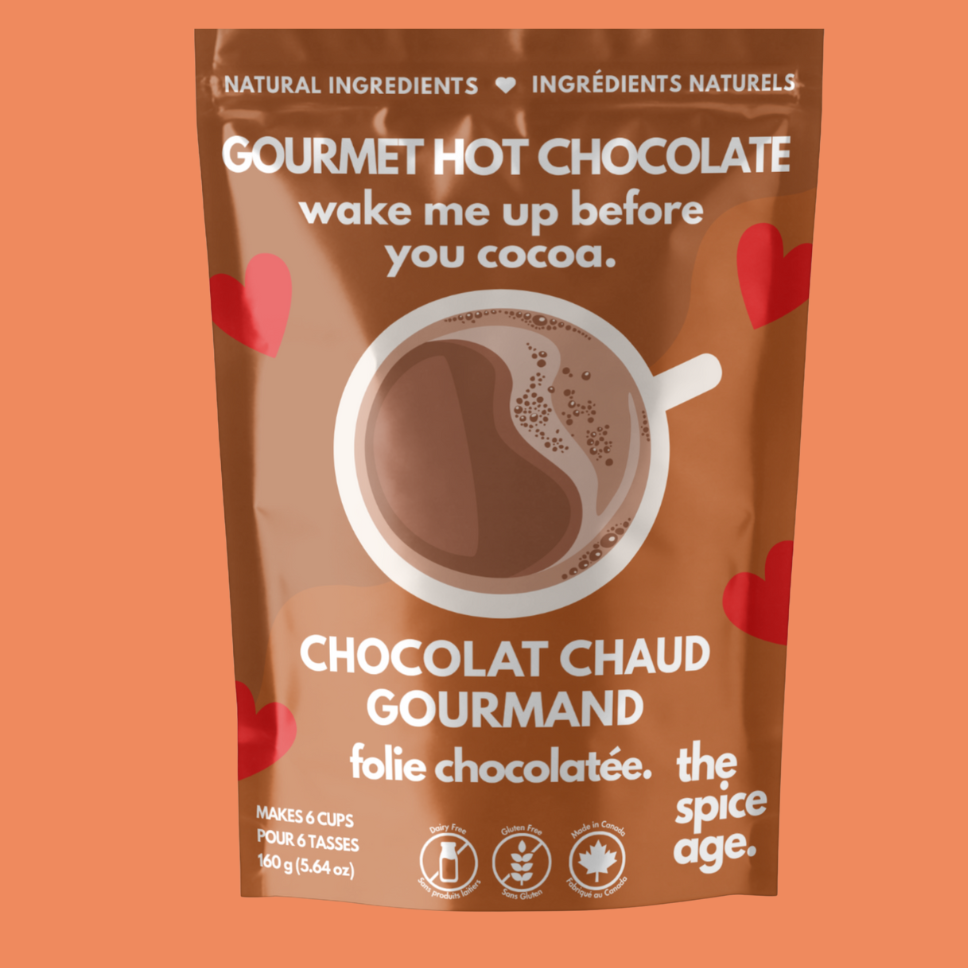 Gourmet hot chocolate package with heart designs on an orange background